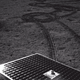 A shot of the lunar surface taken by the Yutu 2 rover, with its solar panels visible.